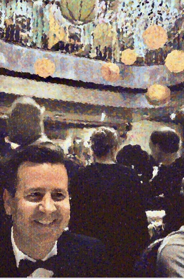 Greg Koons in a tuxedo at a formal event