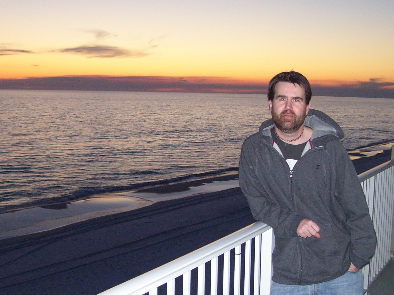 Greg Koons at Santa Rosa Beach Glowing against a dark ocean sky