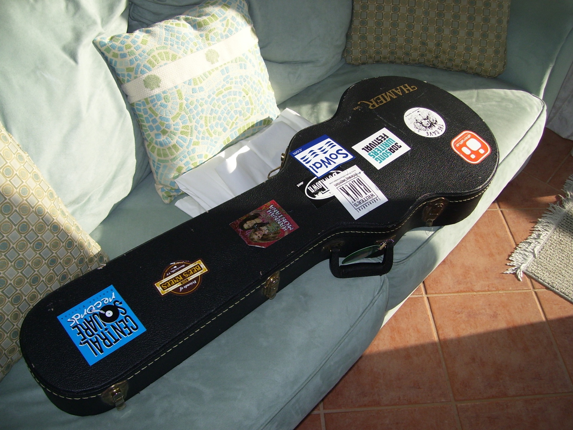Greg Koons's guitar case covered in tour stickers