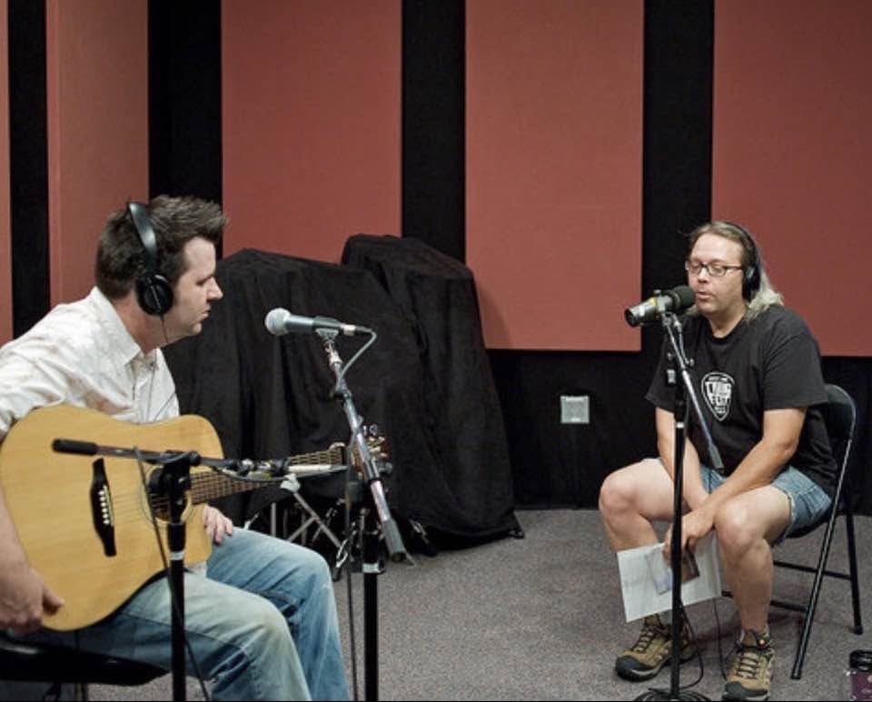 Greg Koons being interviewed in a radio studio